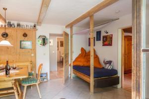 a bedroom with a bed with a wooden frame at Landhaus Lucia in Oberau