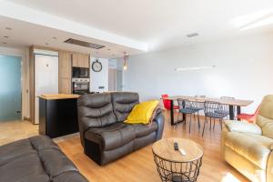 a living room with a couch and a table at Apartamento Palomera Blanes in Blanes
