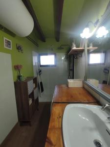 a bathroom with a white tub and a sink at Priorat Tranquil in Lloá +19 photos
