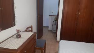 a bathroom with a sink and a table with a mirror at Villa Consuelo in Cambrils +11 photos