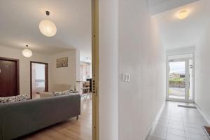 a living room with a couch and a table at São Roque Apartment in São Roque