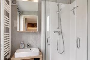 a bathroom with a sink and a shower at Haus Heike in Untergriesbach +11 photos