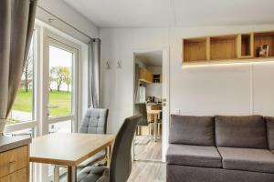 a living room with a couch and a table at Haus Heike in Untergriesbach