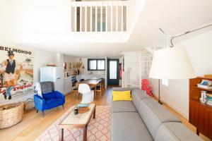a living room with a couch and a table at Villa Xarma, A Deux Pas de l’Océan in Seignosse +25 photos