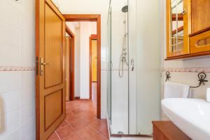 a bathroom with a shower and a sink at Casa Mameli in Quartucciu +19 photos