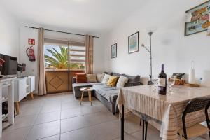 a living room with a couch and a table at Casa Nicole Sea View in Costa de Antigua