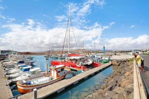 a group of boats docked at a dock at Casa Nicole Sea View in Costa de Antigua