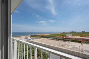 a balcony with a view of the beach and the ocean at Sogno di Mare in Bari