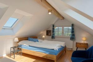 a bedroom with a bed in a attic at Gallushof in Lauterbach
