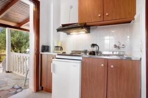 a kitchen with a sink and a dishwasher at Areti Orfeas Apartment 5 in Vasilikos +23 photos