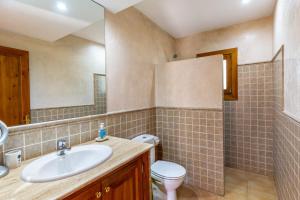 a bathroom with a sink and a toilet at S Estanyol in Colonia de Sant Pere +17 photos