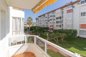 a balcony with a view of a building at Beach and Pool Laguna Beach A113 in Torrox