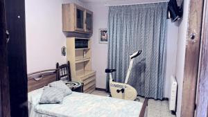 a bedroom with two beds and a window at Casa Johana in El Arenal