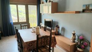 a dining room with a table and chairs in a room at Casa Johana in El Arenal