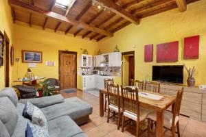 a living room with a couch and a table at Casa Candelaria in Arico
