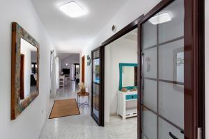 a hallway with a door leading to a bathroom at Casa Margarita in Lanzarote