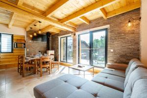 a living room with a couch and a table at Agréable Chalet 3 étoiles App 3 in Courchevel