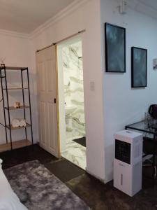 a room with a glass door in a room at Villa Tlhago Lodge in Ga-Mothapo