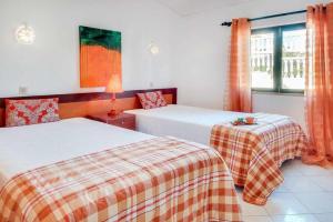 a bedroom with two beds and a window at Villa Brigida in Patroves +14 photos
