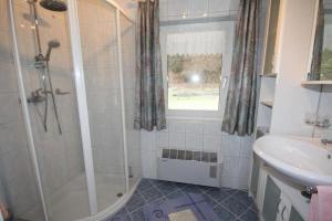 a bathroom with a shower and a sink at Ferienhaus Waldenstein 1 in Waldenstein