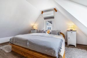 a bedroom with a bed and two night stands at Ferienwohnung Moritz in Lahr