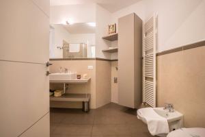 a small bathroom with a sink and a toilet at Residence La Villa Tesoro in Tignale +33 photos