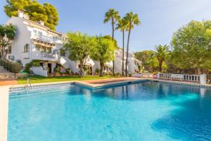 a large swimming pool in front of a house at Casa Sillero Dos in Moraira