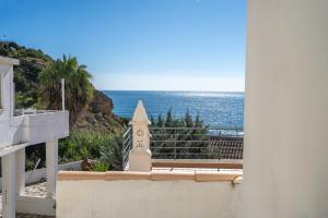 a view of the ocean from the balcony of a house at Casa da Praia 1 in Budens
