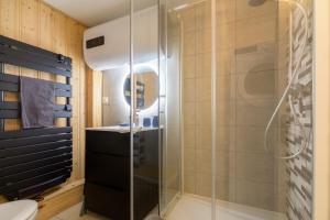 a bathroom with a glass shower and a toilet at Chalet in Mittlach +45 photos