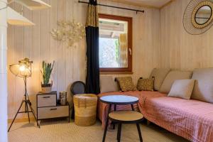 a living room with a couch and a table at Chalet in Mittlach