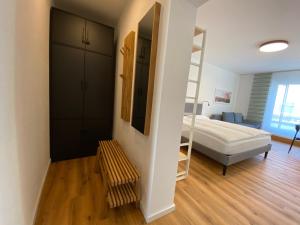 a bedroom with a bunk bed and a ladder in a room at Myzell in Radolfzell am Bodensee