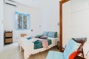 a bedroom with a bed and a mirror at Villa Camilla a Otranto in Otranto +29 photos