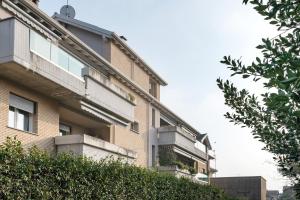 a building with balconies on the side of it at Maison Emozioni Terrace in Limbiate