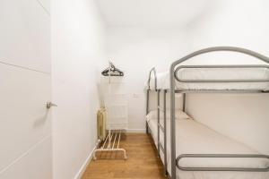 a room with two bunk beds and a closet at Casa Olegari in Almacellas