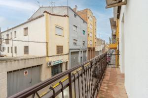 a view from a balcony of a street with buildings at Casa Olegari in Almacellas