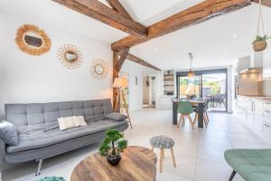 a living room with a couch and a table at La Goisette in Beauvoir-sur-Mer