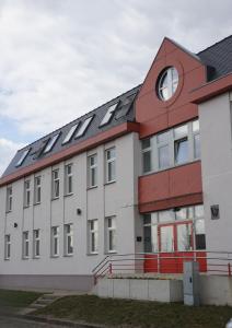a building with solar panels on top of it at Kaiju Apartment 15 in Liepāja