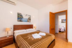 a bedroom with a bed with two towels on it at Finca Goet in Sa Pobla +20 photos
