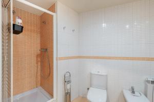 a bathroom with a shower and a toilet and a sink at Niu Turistic Olvan in Olvan +18 photos