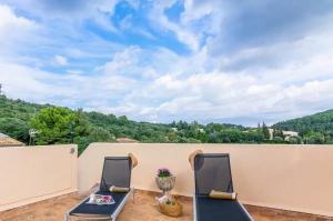 two chairs on a balcony with a view at Puig in Pollença