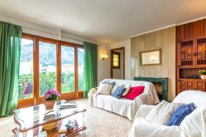 a living room with a couch and a table at Puig in Pollença