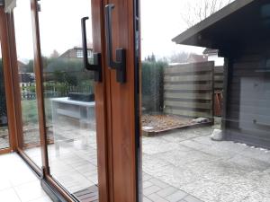 a sliding glass door with a view of a patio at Bei Heike 1 in Zetel