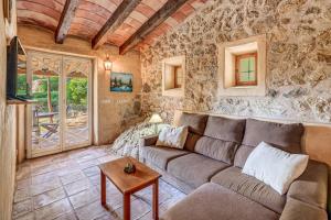 a living room with a couch and a table at Son del Rio Vell in Pollença
