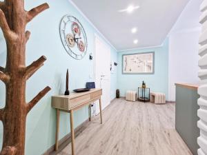 a room with a desk and a tree in it at Casa Diamante Blu Mare in Marina di Campo