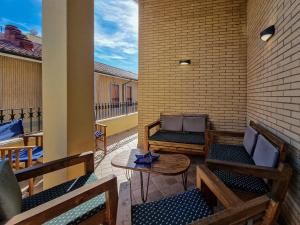 a patio with chairs and a table on a balcony at Casa Diamante Blu Mare in Marina di Campo