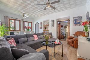 a living room with a couch and a table at Can Xeliu in Sóller