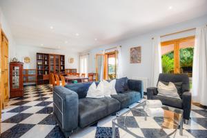 a living room with a couch and a table at Casa Campillos in Llucmajor