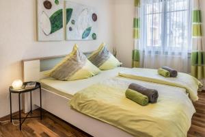 two beds sitting next to each other in a room at Ferienwohnung Stachel A in Konstanz