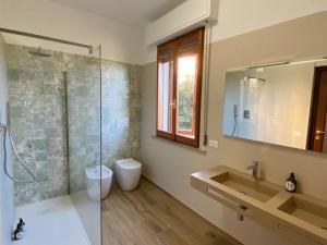 a bathroom with a shower and a sink and a mirror at Via Verdi 14 in Mondolfo +37 photos