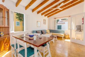 a living room with a table and a couch at Son Xoriguer 5 in Son Xoriguer